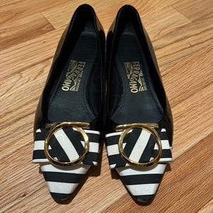 Ferragamo black and white flats with gold detail